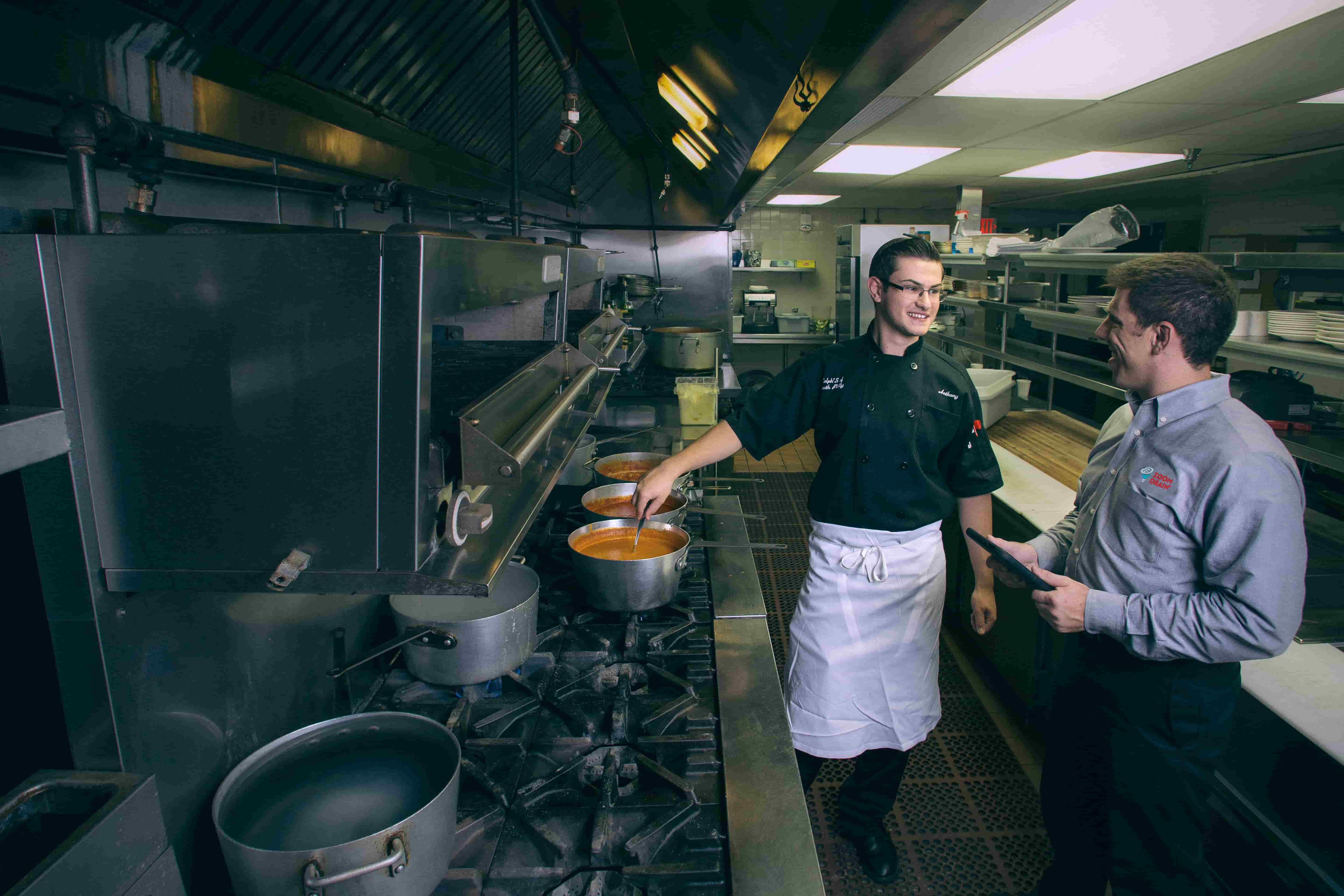 zoom drain employee talking to chef in kitchen