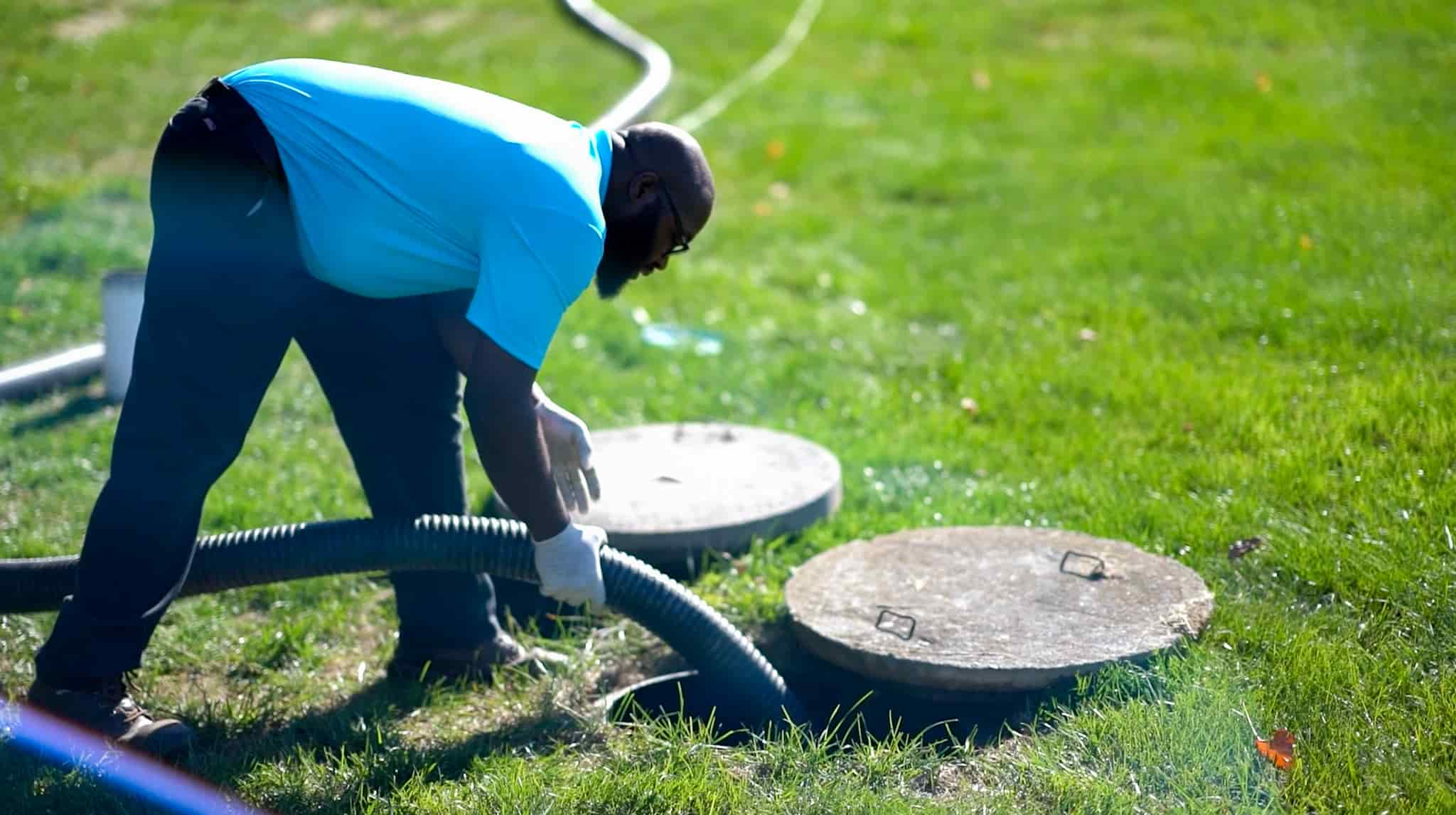 man with septic pump